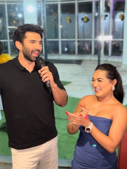 Sharing a laugh with Aditya Roy Kapur. These light-hearted moments are what make an event memorable for both the star and the audience.