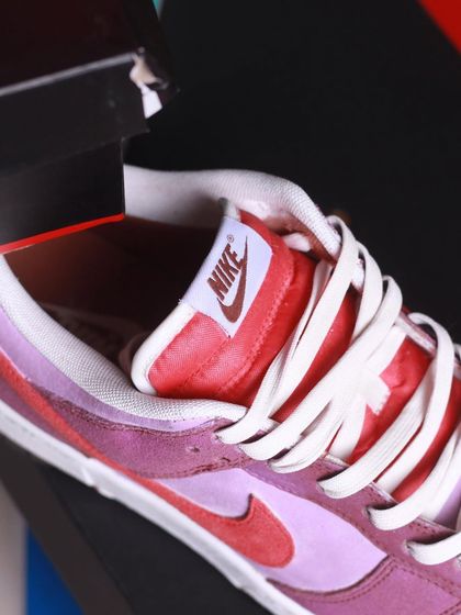 I call these the "Velvet Plum" Nike Dunks. This was a complete transformation of a different colorway using suede dye. It shows how you can totally change the look of a shoe.