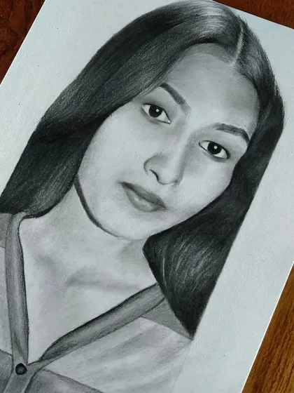 A simple and elegant portrait of a young woman. I can create a beautiful, minimalist sketch from your photo.