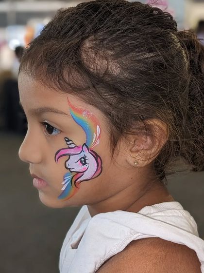 A simple and sweet unicorn cheek art, perfect for younger kids or as a quick festival design.