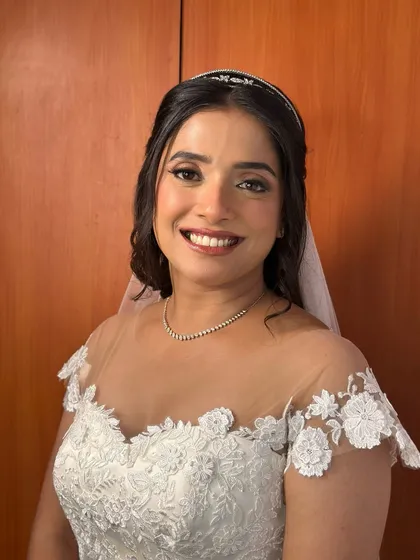 A picture of modern grace for a Christian wedding. I created a soft glam look with luminous skin, subtly defined eyes, and a gentle pink lip to enhance her natural beauty, ensuring she looked and felt timelessly elegant in her beautiful white gown.