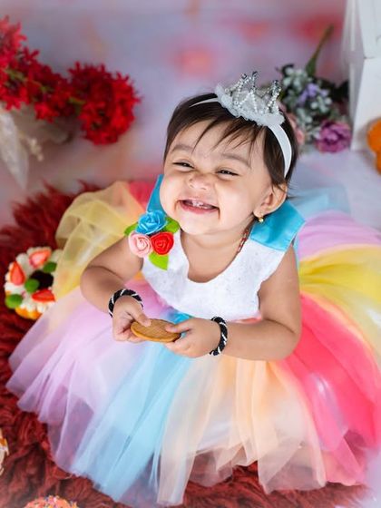 A huge, happy grin from the birthday girl in her cookie-themed wonderland.