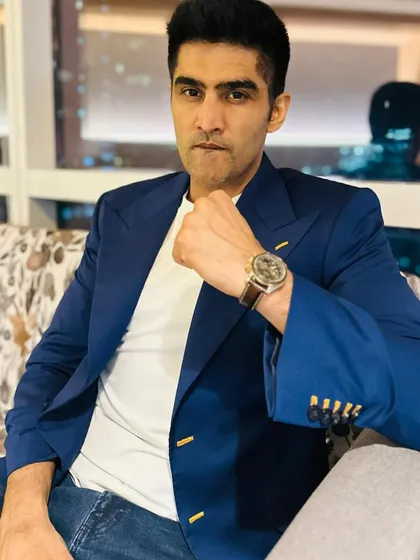 I designed this classic blue formal jacket for Vijender Singh. The piece is elevated by handcrafted detailing over the buttonholes and wide golden buttons, turning a timeless staple into a work of art.