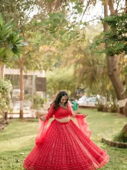 A wide shot of the red lehenga, perfect for a pre-wedding photoshoot. Renting allows you to have different looks for all your events.