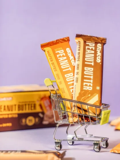A playful shot of wafer bars in a miniature shopping cart. This creative concept is memorable and adds a touch of fun to the product's marketing.