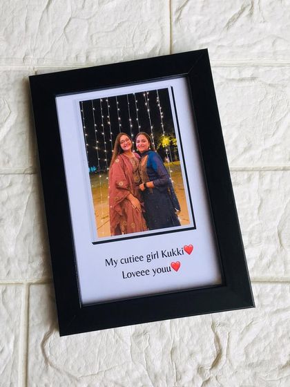 A simple yet elegant 4x6 inch framed gift, featuring a single photo with a personalized caption written below it.