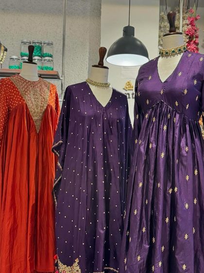 Another view of the festive orange and purple collection, showcasing the variety of silhouettes available.