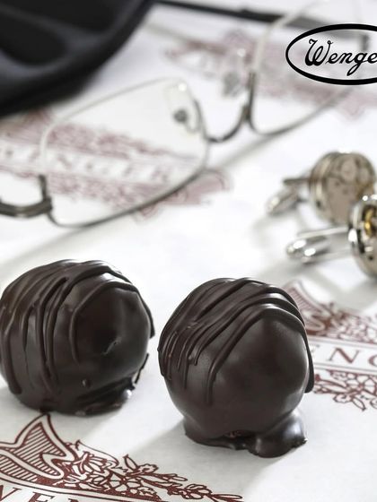 A treat for Father's Day. Two of our classic dark chocolate truffles, a simple, elegant, and delicious way to show appreciation.