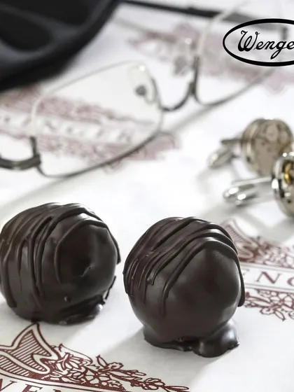 A treat for Father's Day. Two of our classic dark chocolate truffles, a simple, elegant, and delicious way to show appreciation.