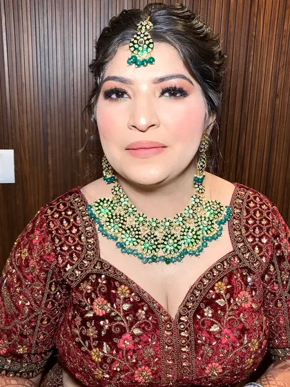 Another angle of the bride, highlighting the intricate embroidery on her lehenga that matches the jewelry.