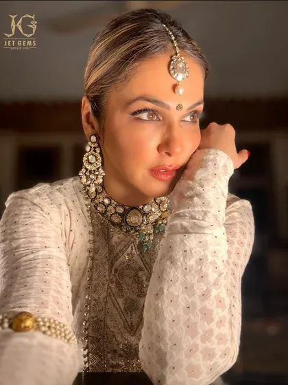 A moment of quiet grace. Isha Koppikar Narang looks absolutely radiant, with the traditional Polki jewellery adding a timeless and royal glow to her profile.