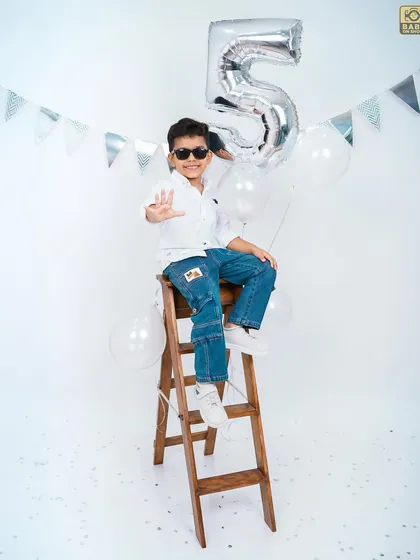 A fun, high-energy pose on the ladder. I always try to make the sessions feel like playtime for the kids.