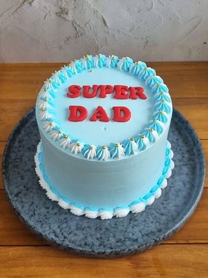 Our "Super Dad" cake, a bold and sweet way to celebrate the superhero in your family.