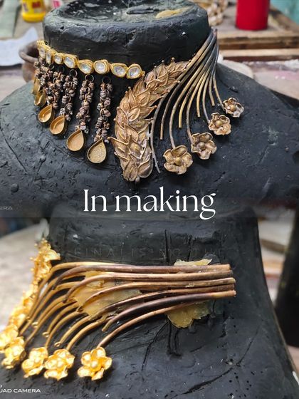 A look at the "in making" stage. Here, the gold pieces are being assembled on a mold, showing the intricate craftsmanship required to bring the new design to life.