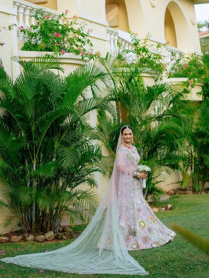 A full-length view of Tithi's gorgeous pastel lehenga with its long, dramatic veil. A truly stunning Goa bride.