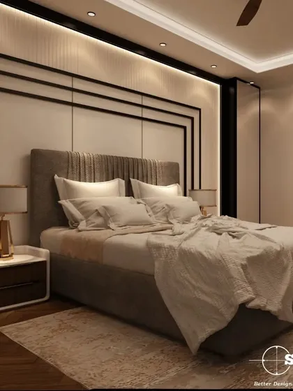 A side view of a master bedroom, showing the custom bedside table and the layered textures of the bedding and rug. The design focuses on creating a warm and inviting space with a neutral palette.