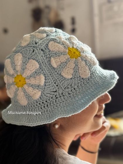 Our daisy crochet bucket hat is made with a lovely sky-blue yarn and features 3D-style petals. It’s a soft, comfortable, and whimsical accessory perfect for a breezy day out.
