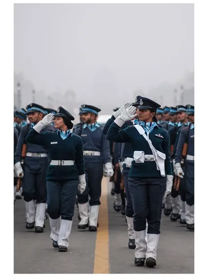 Female officers of the Indian Air Force salute with pride as they march during Republic Day rehearsals.