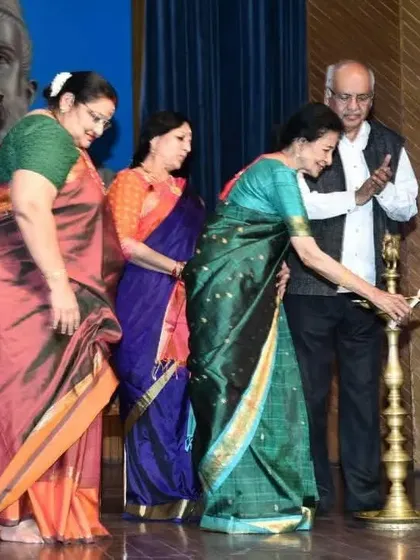 Lighting the lamp at the Delhi Tamil Sangam felicitation ceremony. This traditional act symbolizes the dispelling of darkness and the invocation of auspicious beginnings, a sentiment that resonates deeply with my art.