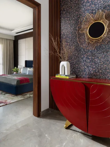 This view shows the entryway console in context, offering a peek into an adjacent bedroom and demonstrating how color can be used to connect different spaces.
