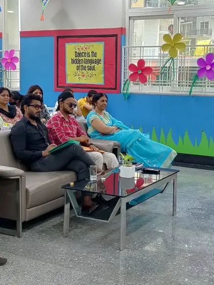 A wider view of the judging panel at a school event. The quote on the wall, "Dance is the hidden language of the soul," is something I truly believe in.