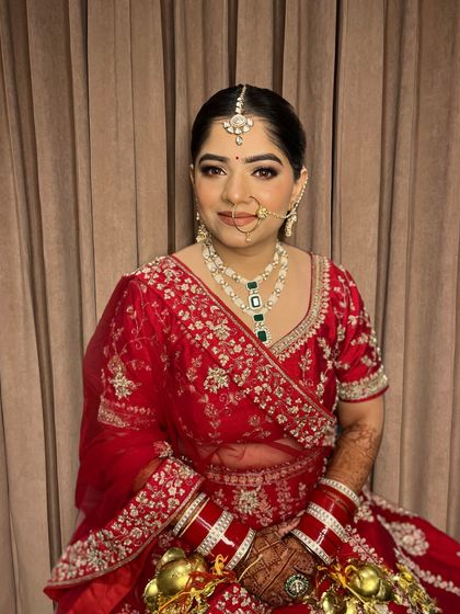 A portrait of Jaya, showcasing her radiant skin and the beautiful symmetry of her makeup.