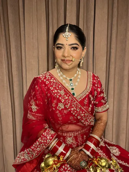 A portrait of Jaya, showcasing her radiant skin and the beautiful symmetry of her makeup.