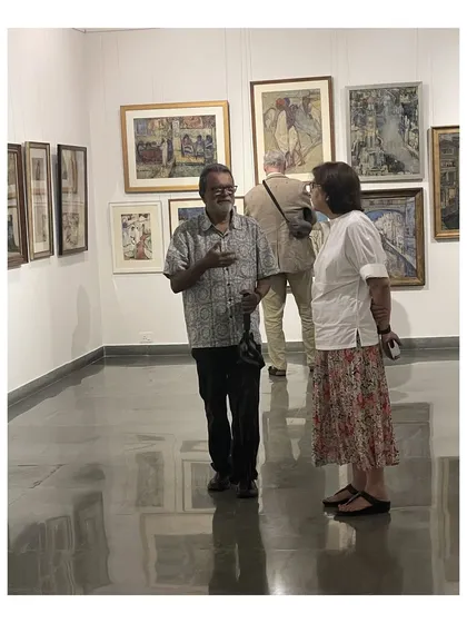 Visitors engage in conversation during the Vidya Bhushan exhibition. My gallery is a space for dialogue and connection, where people can immerse themselves in art and share in the experience.