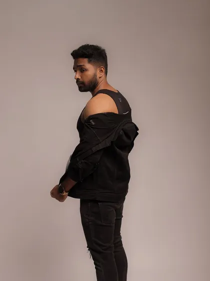 A dynamic pose looking over the shoulder, creating a sense of intrigue. This is a great example of a branding shot that conveys attitude and personality.