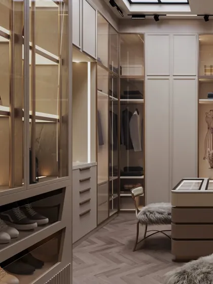 A closer look at the custom cabinetry, which includes a mix of glass-fronted and closed storage, all finished with elegant, minimalist hardware.