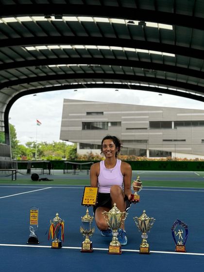 A showcase of dedication paying off. Our performance player, Yashi, with her collection of trophies from recent AITA tournaments, reflecting her consistent hard work and success.