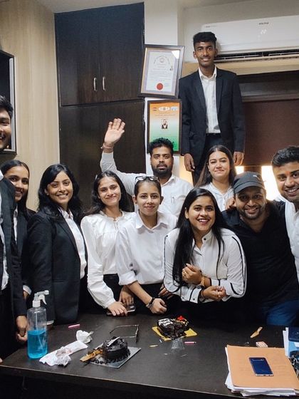 Celebrating a milestone in the office with my dedicated team of interns and colleagues.