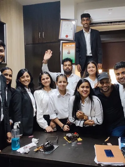 A moment of celebration with my team at the office. We work hard together and celebrate our successes together.