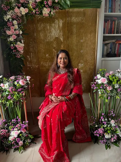A seated portrait from my baby shower, surrounded by beautiful flowers. Feeling so grateful and happy.