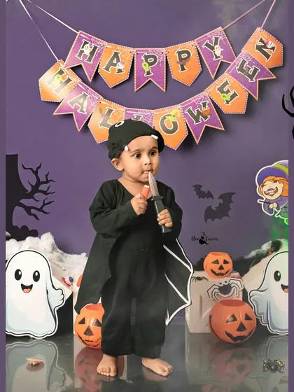 A playful bat with a toy knife, adding a bit of spooky fun to his Halloween costume. His expression is full of mischief.