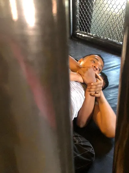A candid shot from our BJJ Jam showing a rear-naked choke attempt. These friendly competitions are a great way to practice submissions under pressure.