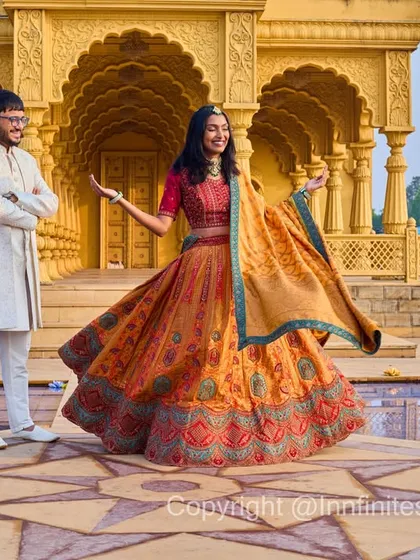 A playful twirl by the water feature of our golden palace set. We love capturing these joyful, candid moments during a pre-wedding shoot.