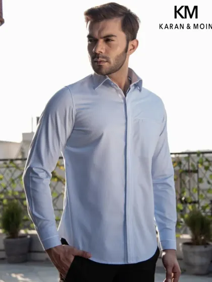 The same light blue textured shirt, shown in a full-length view. The tailored fit ensures it looks sharp whether tucked in or worn out.