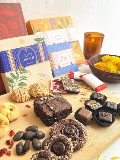 A glimpse of our festive collection, perfect for celebrations like Diwali. We offer a wide range of artisanal treats, from traditional nankhatai to modern chocolate truffles, all presented in beautiful gift boxes.