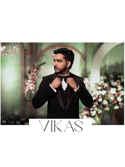 A portrait of the groom, Vikas, adjusting his bow tie, a classic getting-ready shot.