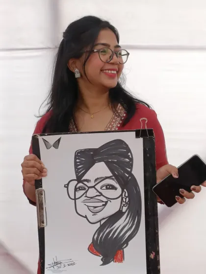 Her glasses and turban were fun features to draw. She was really happy with the result.