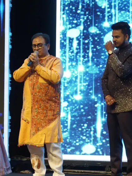 A touching moment on stage as the groom gets emotional while Mr. Dilip Joshi speaks. These are the heartfelt memories that make a wedding special.