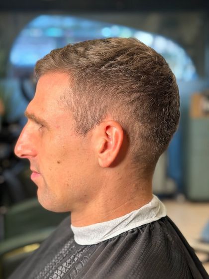 A modern high fade on a classic men's cut. This keeps the style looking traditional but with a fresh, updated finish.
