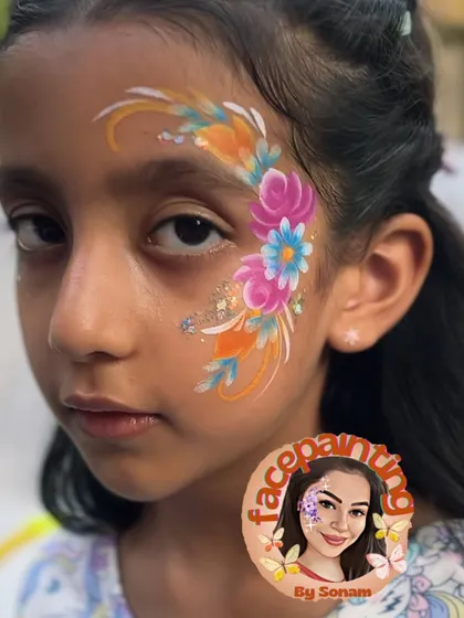 A close-up of a vibrant floral design with a mix of warm and cool colors. The glitter adds a beautiful shimmer.