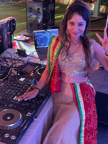 Behind my professional Pioneer setup at an outdoor Garba night. I'm ready to get the party started with a mix of traditional and modern dance music.