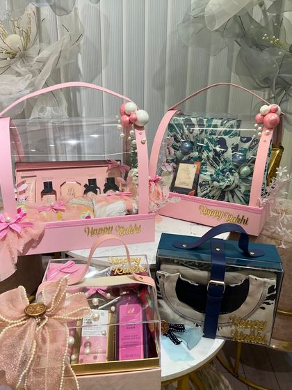 A collection of our pink-themed Rakhi hampers. From acrylic baskets to trunk boxes, we have a variety of options for the sister who loves pink.