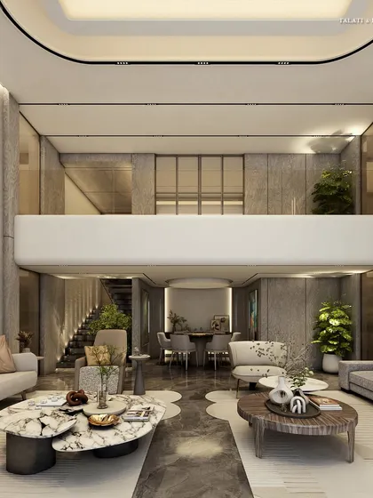 A wider view of a minimalist living room, where luxury is intertwined with the design aesthetic. Expansive double-height areas are given intimate touches, pairing grandeur with comforting warmth in a setting that is free of clutter yet rich in character.