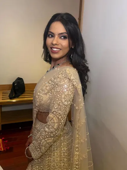 This engagement bride wanted minimal glam with a wow moment. Her look in a stunning golden lehenga is soft, dreamy, and absolutely stunning.