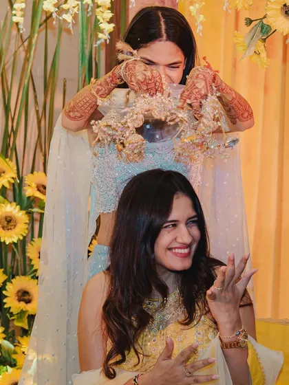 The moment a piece of the kaleera falls, and the next bride-to-be is chosen! It's a moment of pure joy and friendly banter that I love to witness.
