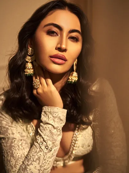 Another angle of Khatija Iqbal's stunning look. The lighting highlights the delicate details of the makeup and the intricate embroidery of her outfit.